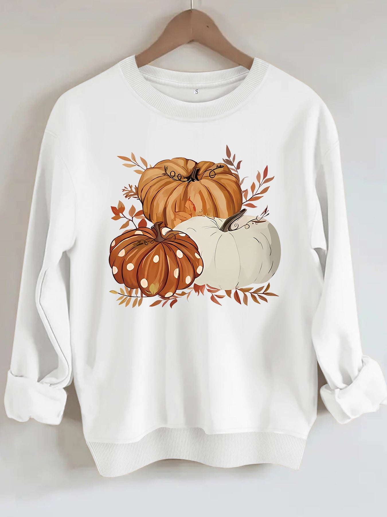 Three pumpkin patterned printed hoodies
