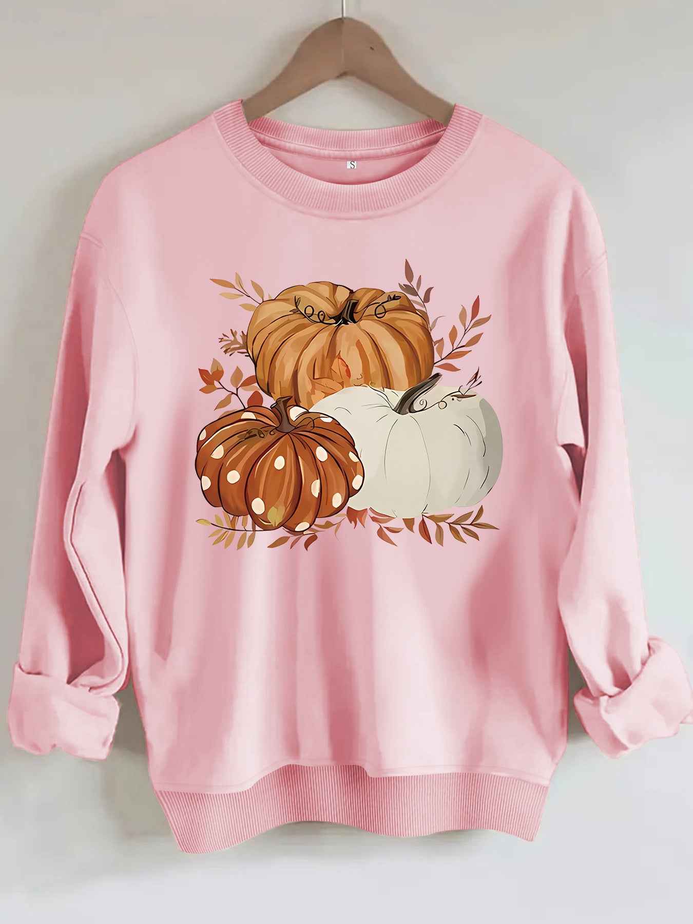 Three pumpkin patterned printed hoodies