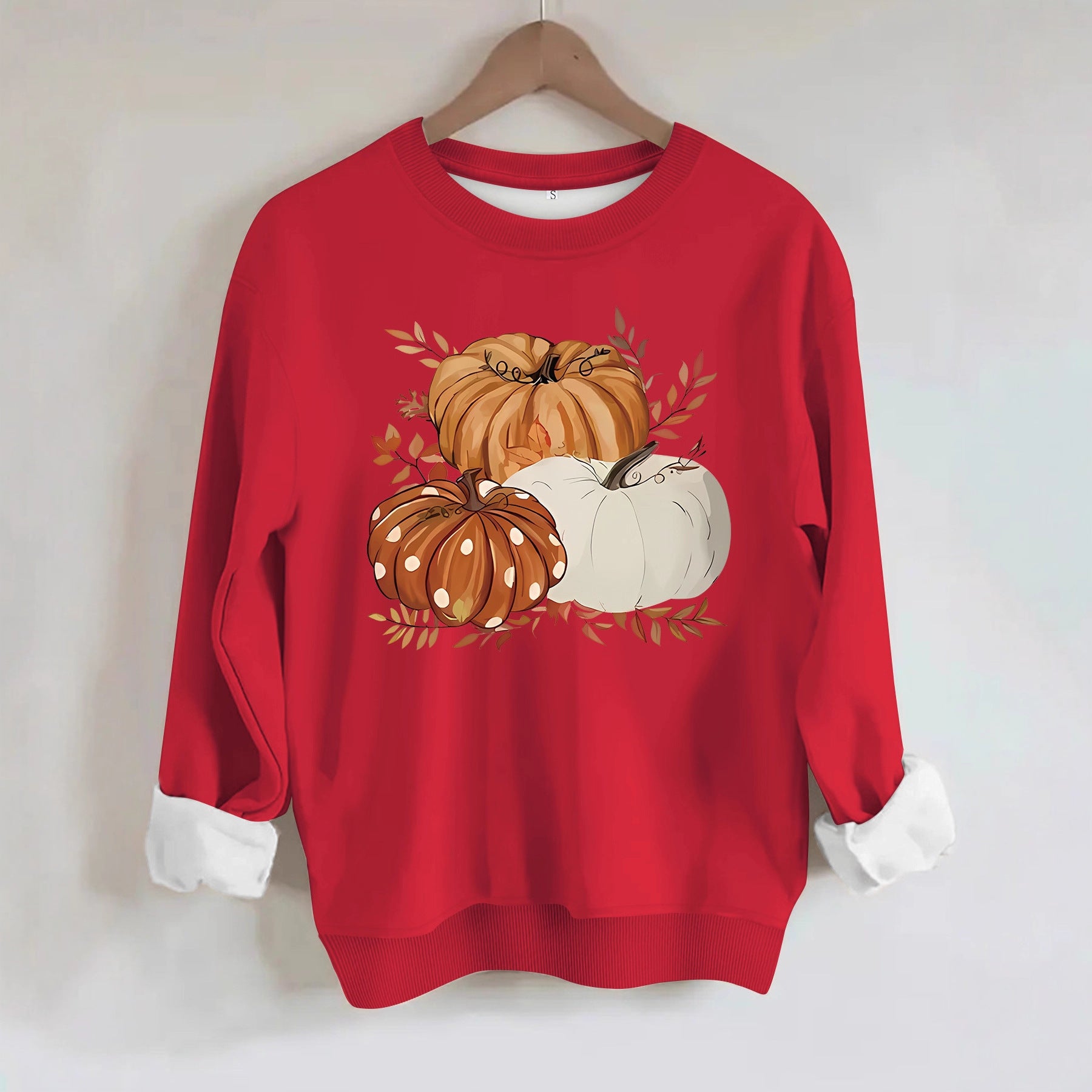 Three pumpkin patterned printed hoodies