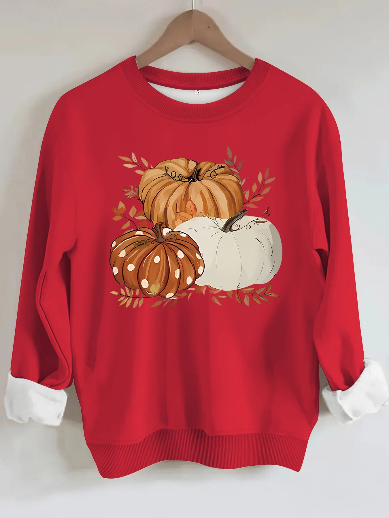 Three pumpkin patterned printed hoodies