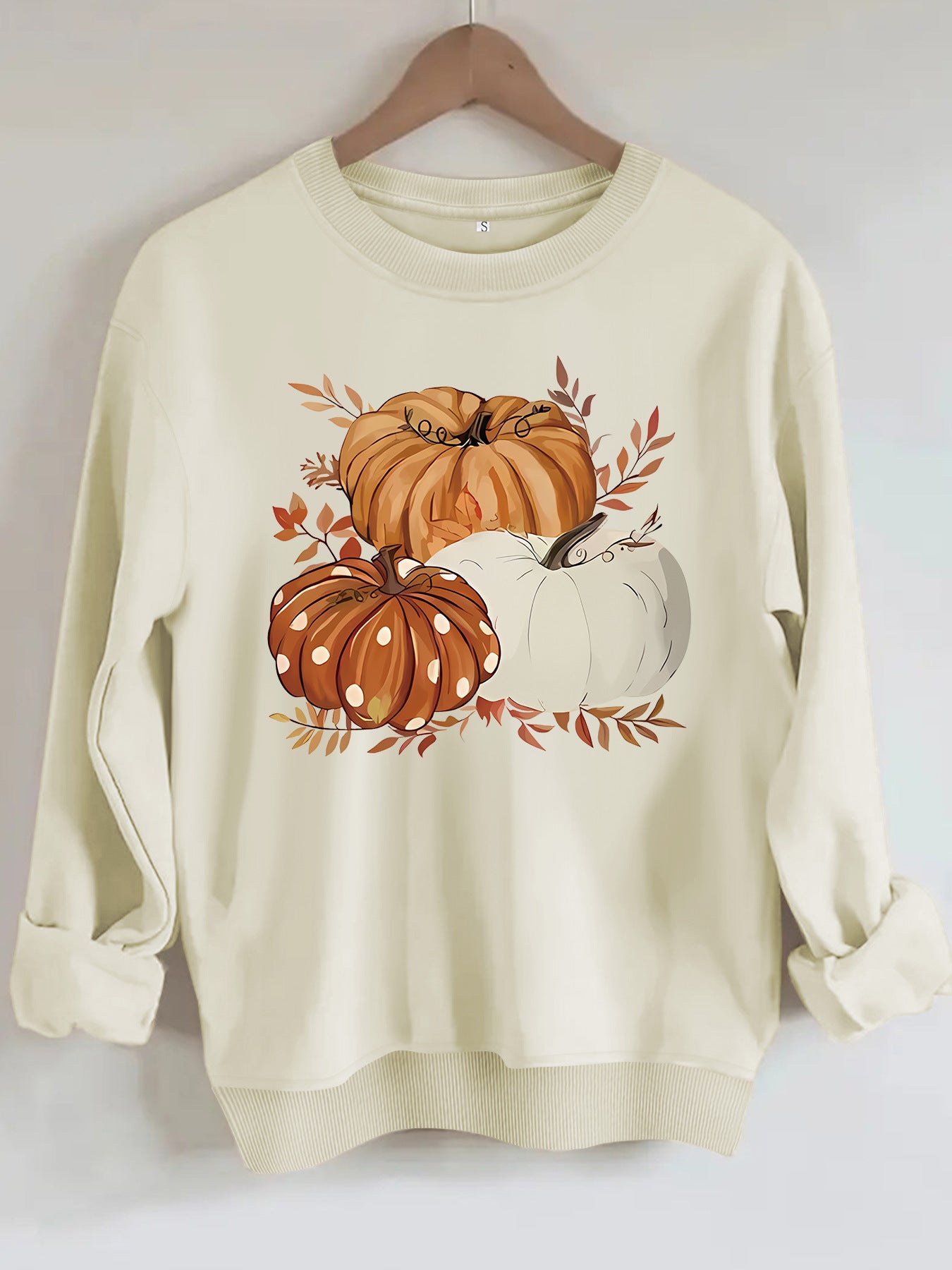 Three pumpkin patterned printed hoodies