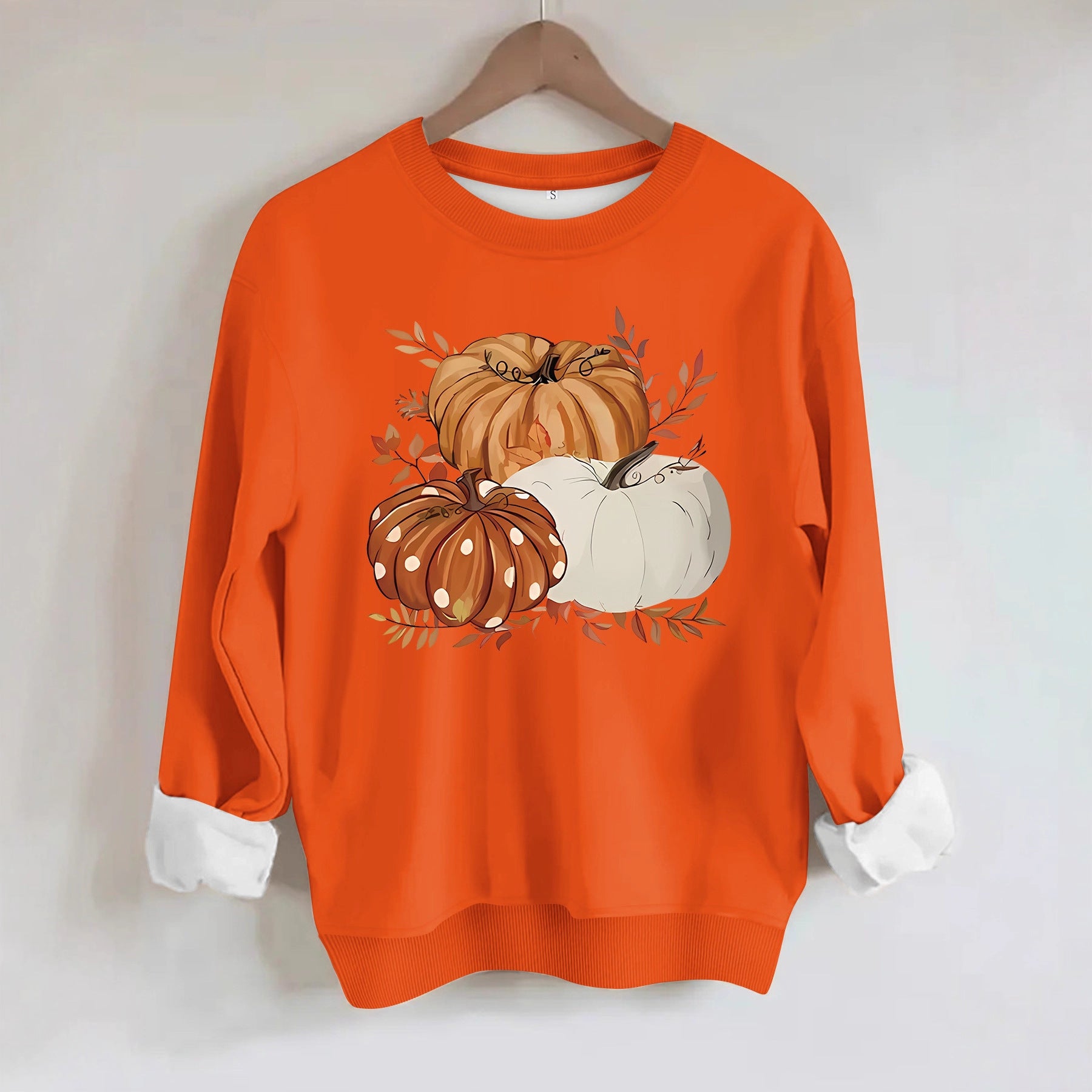 Three pumpkin patterned printed hoodies