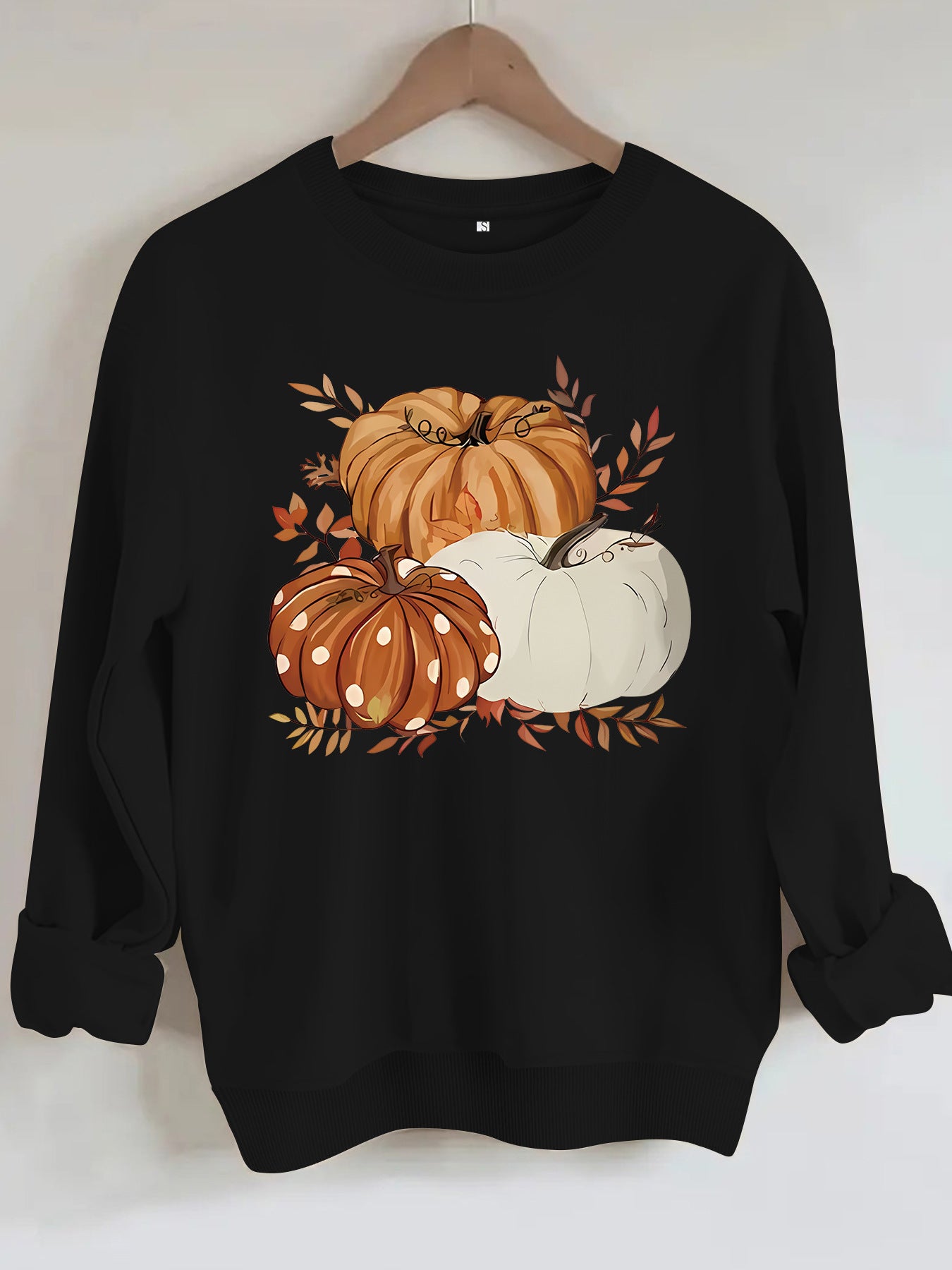 Three pumpkin patterned printed hoodies