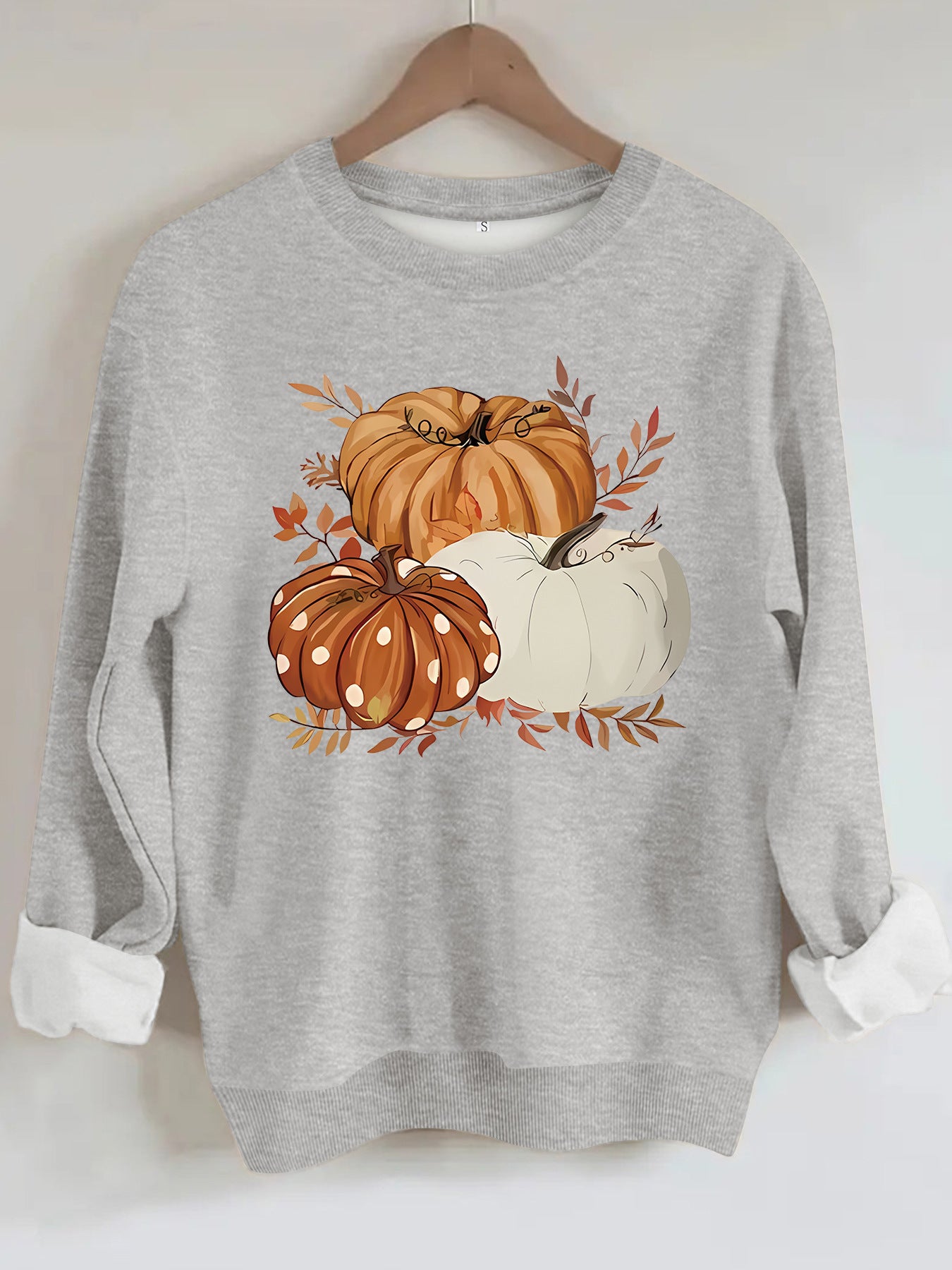 Three pumpkin patterned printed hoodies