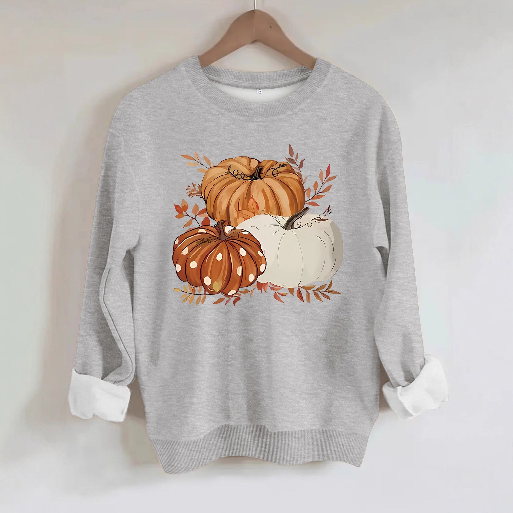 Three pumpkin patterned printed hoodies