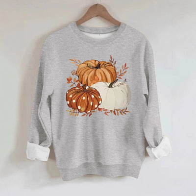 Three pumpkin patterned printed hoodies